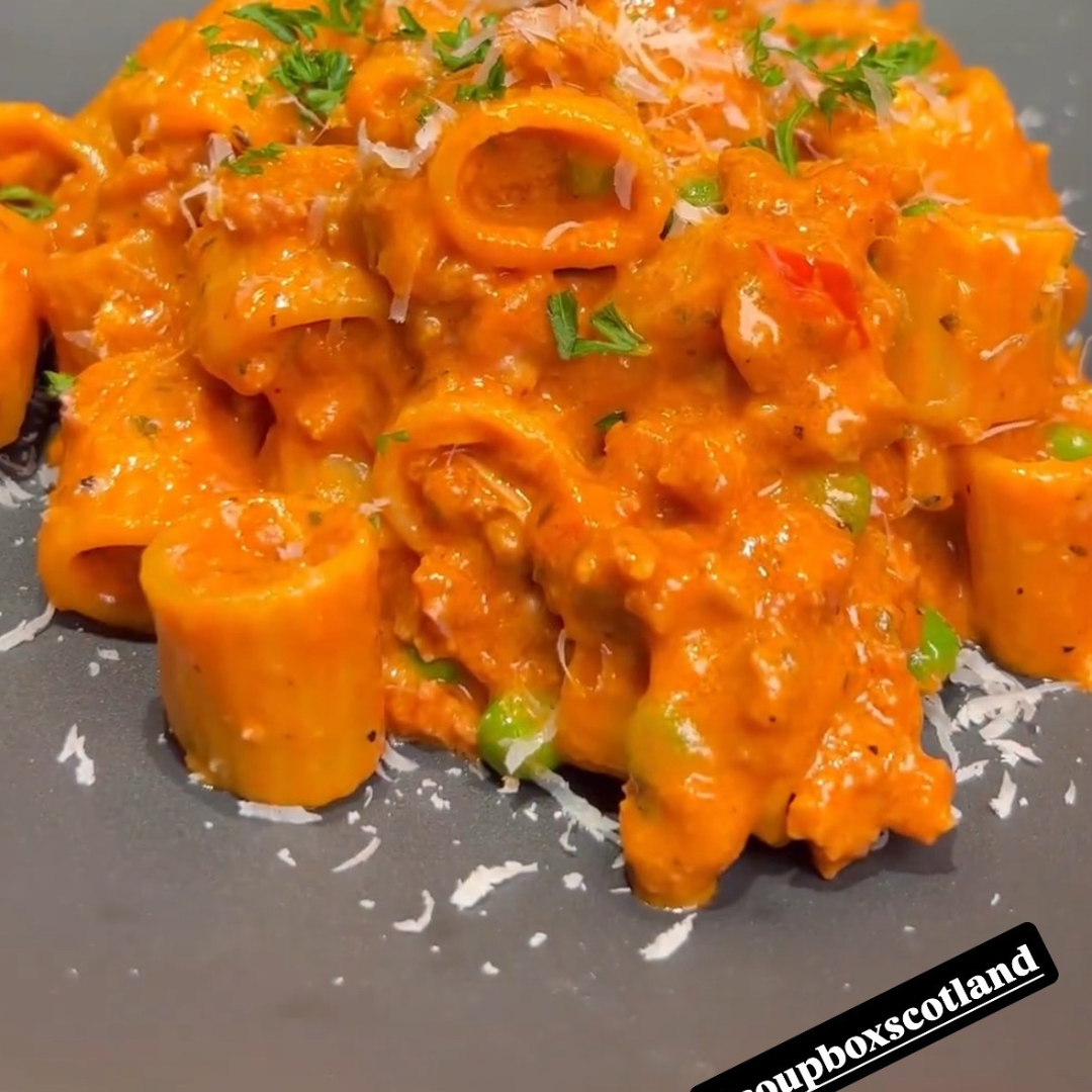 NYC Style Spicy Italian Sausage Pasta. Creamy Tomato Sauce. Peas