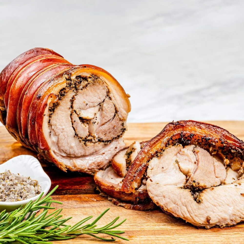Italian Roast Porchetta with Black Pudding, Rosemary & Garlic Stuffing. Roast Potatoes. Sweetheart Cabbage. Pork Gravy (L)