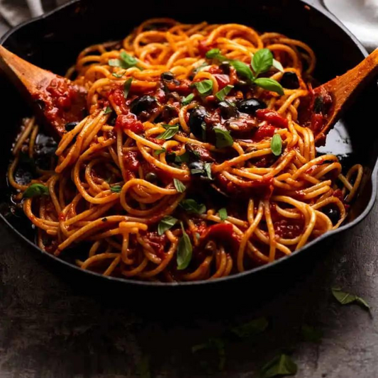 Puttanesca Pasta with Fresh Basil & Olives. Parmesan Garlic Ciabatta Bread!