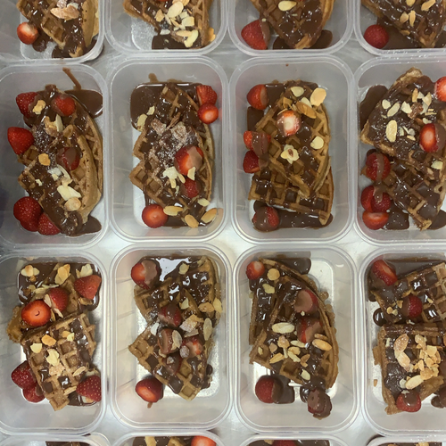 Belgian Chocolate Chip Waffles. Strawberries. Blueberries. Chocolate Drizzle